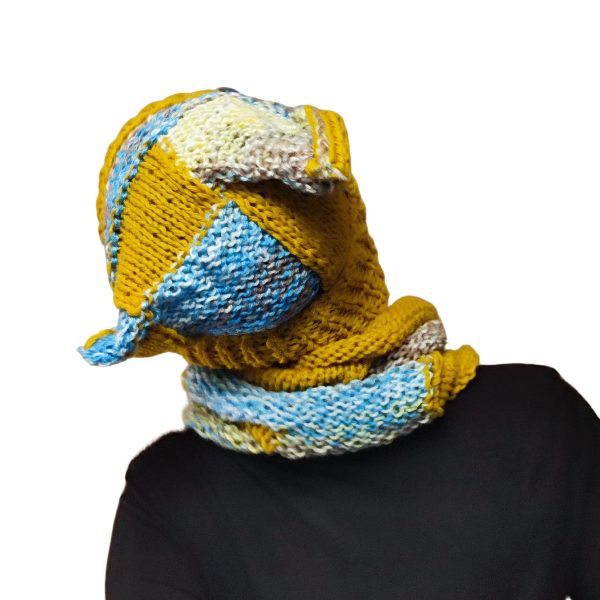 Chaotic Squirrel hat and snood in city street setting, playful autumn palette