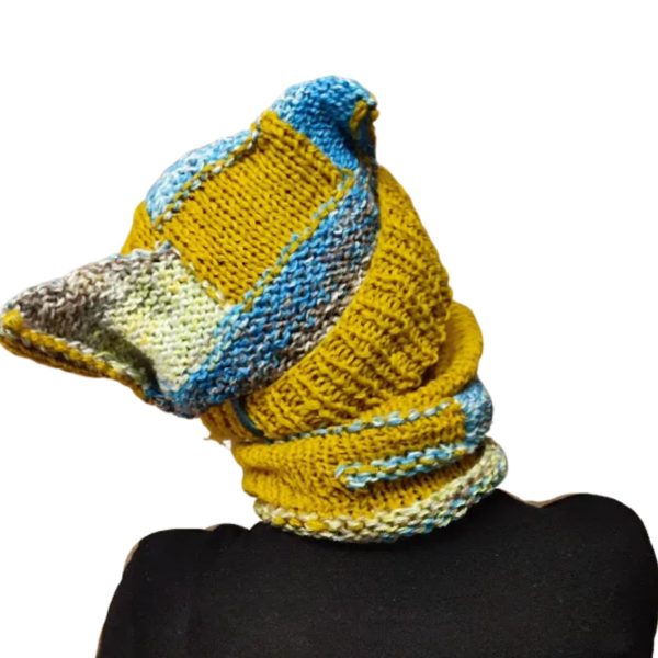 Chaotic Squirrel hat and snood on model, highlighting playful and audacious vibe