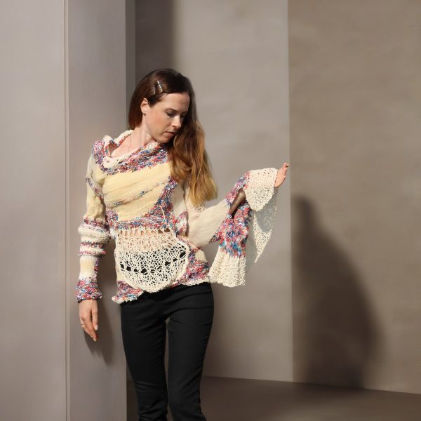 Elegant Burst expressive dual-texture knit with relaxed fit and playful sleeve contrast