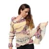 Elegant Burst loose-fitting reversible sweater with one sleeve snug and the other wide