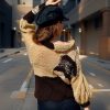 Elegant Contrast versatile reversible knit with gentle hues and bold asymmetrical design