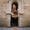 Flowing knit cape with playful asymmetry