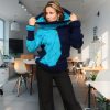 Textured navy knit sweater with light blue cable patterns on sleeves