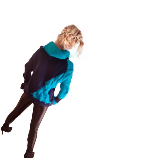 Cozy cold-season sweater blending soft textures and striking blue tones