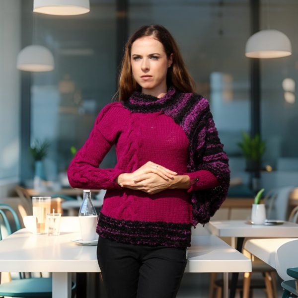 Contemporary artistic knit in deep plum with cape-style asymmetric sleeve.
