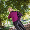 Stylish fitted knit with asymmetric design in rich plum and black.