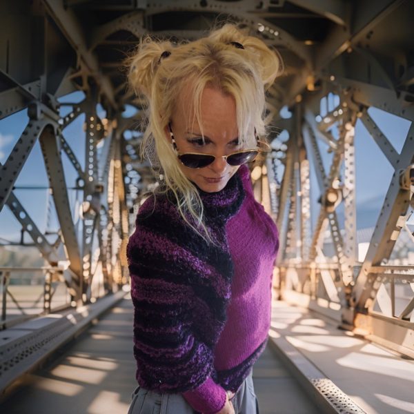 High-fashion sweater in plum and black boucle for artistic looks.