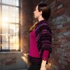 Plum Cascade – artistic knit with sculptural cable knit and boucle cape sleeve.