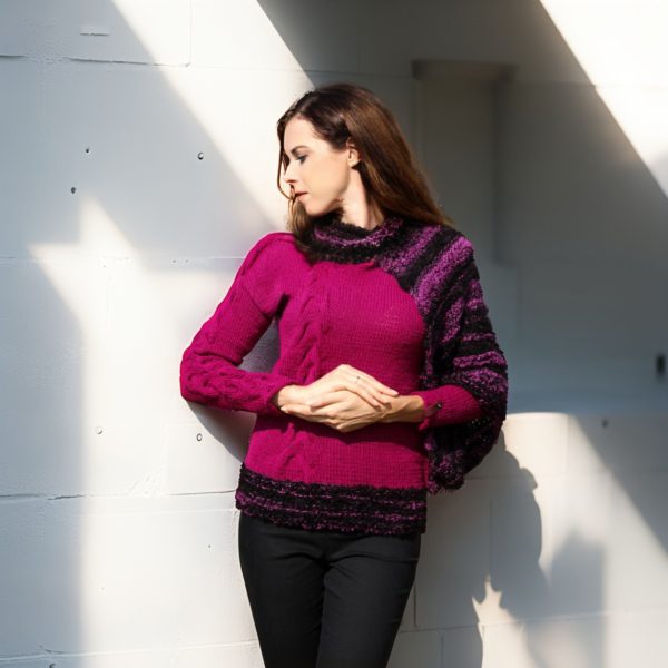 Chic sweater combining deep plum elegance with playful textured contrasts.