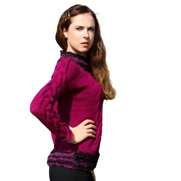 Luxury sweater in plum with textured black bouclé and artistic asymmetry.