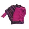 Artistic women’s sweater blending dense plum knit with looped bouclé texture.