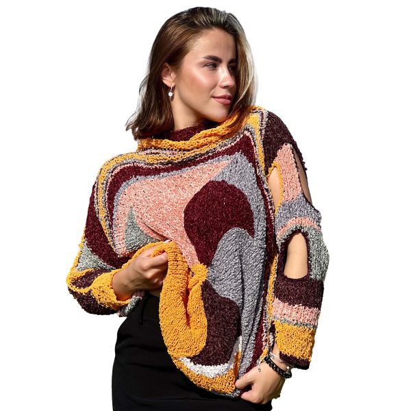 Plush Enigma in plush texture with circular cut-outs on shoulder and sleeve, revealing daring asymmetry