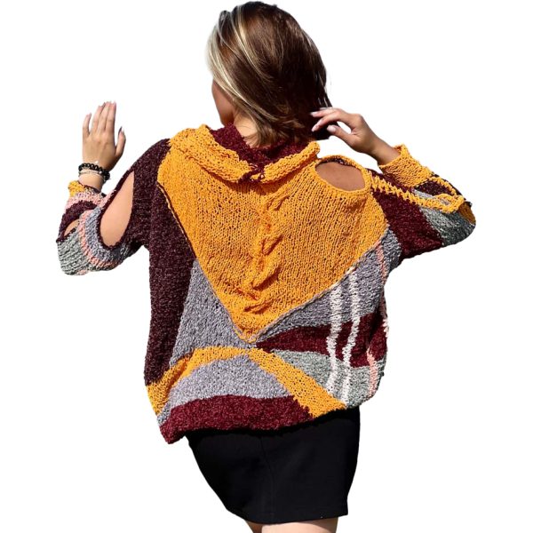 Plush Enigma, a loose-fit garment blending spirals and radiating stripes in unexpected harmony.