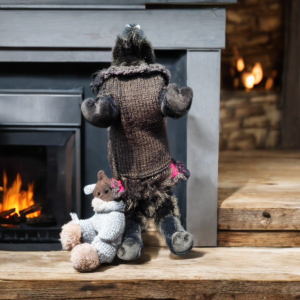 Rebel Elegance cozy black pet sweater with bright pink ruffles and skull details for cats and dogs