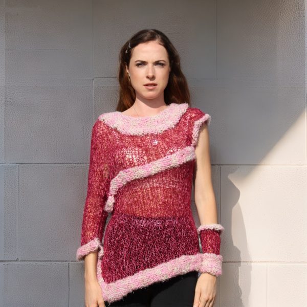 Rosy Dusk asymmetric knit highlighting playful cuff and elegant motion