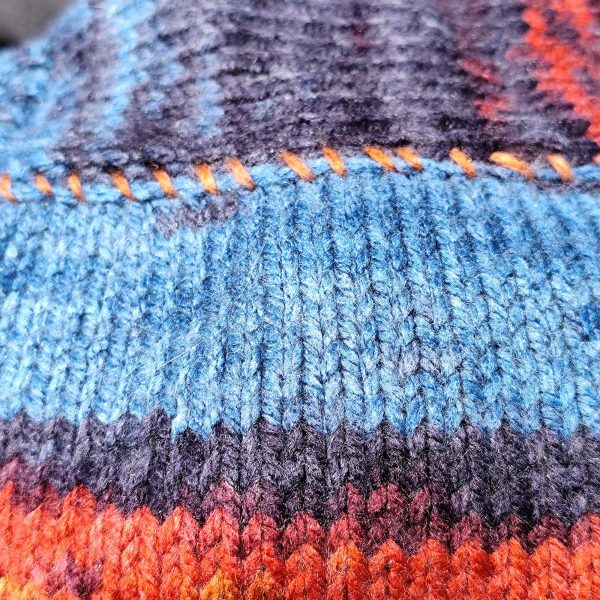 Striped Snuggle Suite colorful pet fashion clothing with artistic stripes, blending comfort and style for small dogs
