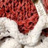 Tiny Tornado sweater for dogs and cats, playful frills and bow, muted red with white accents, cozy and stylish