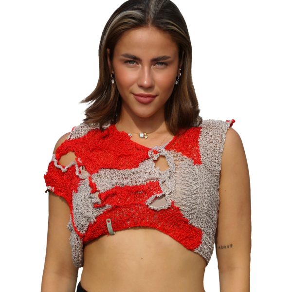 Fire red knit top with reversible design on model